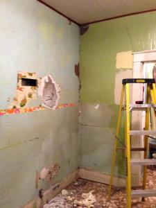 The walls are revealed to be a very old plaster -perhaps dating to the house's original date of 1909...